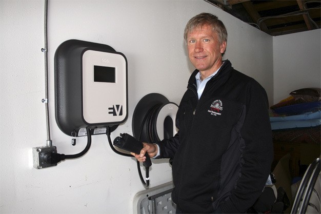 Scott Jenkins of Mercer Island is the first residential customer to have an electric vehicle charging station installed in his home.