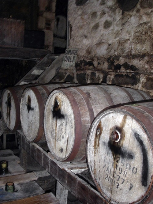 Rum from local sugar cane is still produced at this primitive Tortola Island rum factory in the Virgin Islands.
