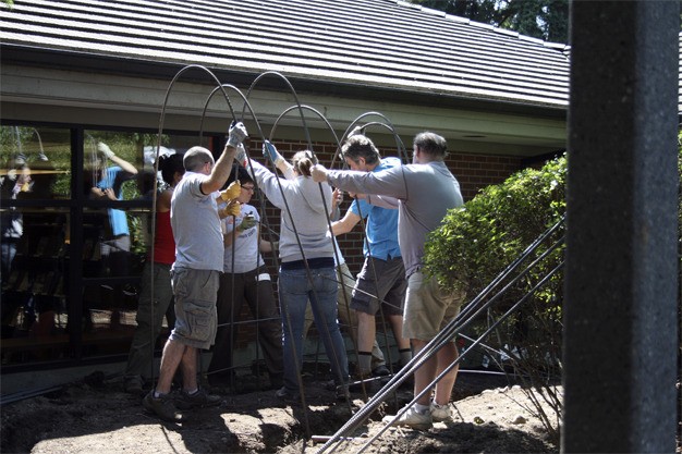 Volunteers prepare the Literacy Garden to open this weekend at the Mercer Island Library.