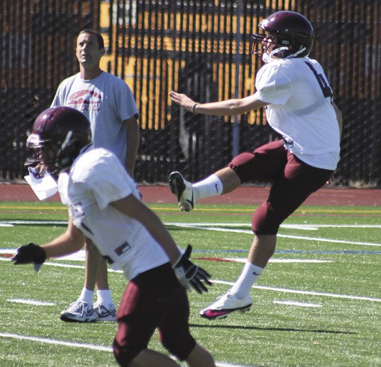 Mercer Island High School kicker Alex Wood launches a ball during offensive drills.