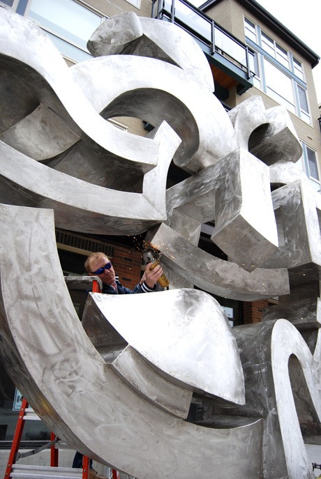 A new public sculpture by Northwest artist Harold Balazs was erected outside 77 Central on Oct. 11. The stainless steel ‘Circle of Friends’ is located on 78th Avenue S.E.