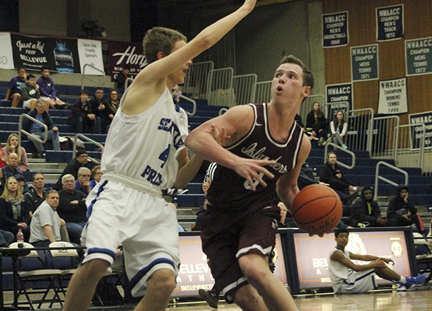 Mercer Island's Josh Stenberg fights for his shot against Seattle Prep's Nikola Trifunovic Friday