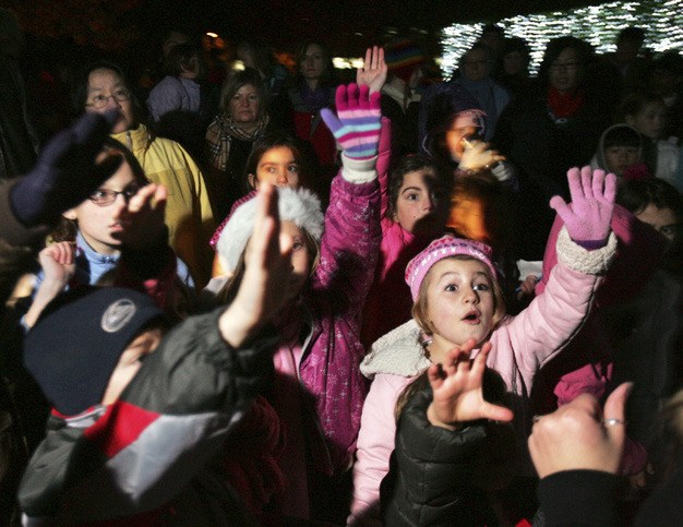 Children beg to be chosen for a game hosted by Radio Disney