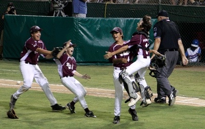 Mercer Island catcher Aidan Plummer jumps into the arms of relief pitcher Brandon Lawler as the team celebrates their 8-3 victory over Oregon's Parrish Little League and invitation to the 2009 Little Leaugue Baseball World Series.