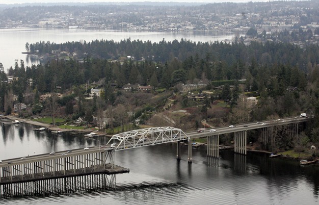 Cars drive over the SR-520 bridge before the tolls are put into place