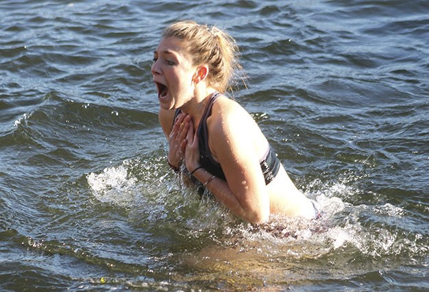 Islander Lena Harder does her best to endure the 45-degree water during the 48th annual Polar Bear Plunge Friday