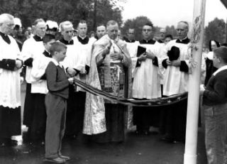 Above: Archbishop Thomas Connolly offers blessings at the school and parish around 1960. At right: Fr. John Walsh