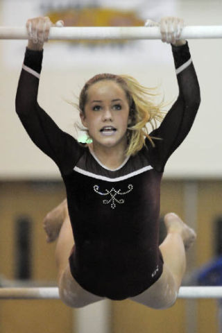 Islander Stephanie Pedreira competes in the uneven bar event.