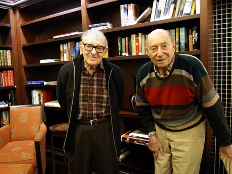 Fred Fiedler and Otto Baumgarten stand in the Aljoya House library on Dec. 17. The two men are World War II immigrants who fled from Austria