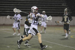 Islander Graham Horgdal slings a pass during the game against West Linn