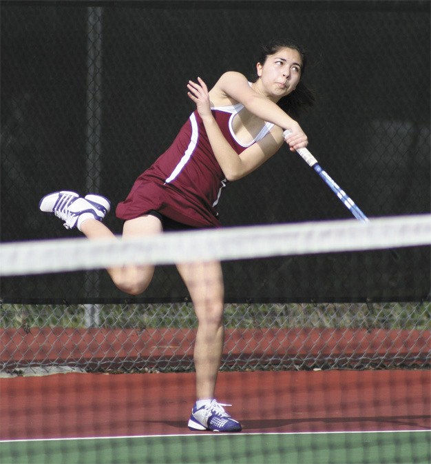 Karissa Walker returns a ball for the Islanders during a singles match against Sammamish last Tuesday.