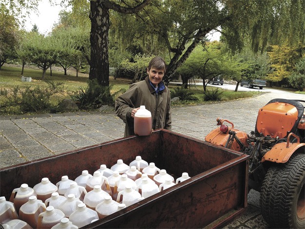 Barbara Coval was busy making and loading dozens of gallons of fresh apple cider at her North end home on 84th Avenue S.E. last week. Coval uses apples from her own trees