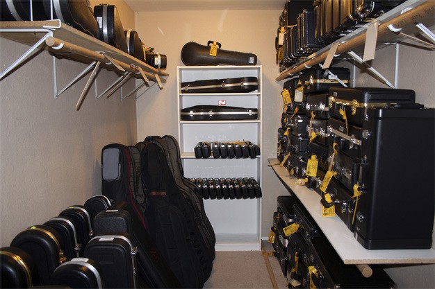 Instruments line the storage area at Mercer Island Music