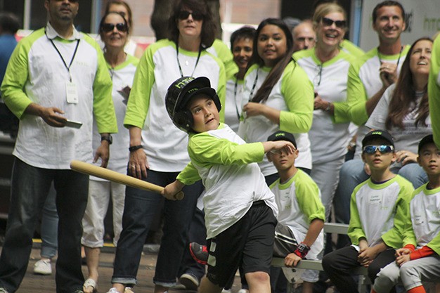 Islander Joey Weiss watches his ball after swinging for a home run at the Cano Crush kids home run derby Friday at Occidental Park in Seattle.