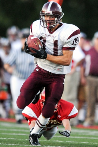 Mercer Island WR Bryce Borer (81) races to the endzone for the first of two first half receiving touchdowns at Newport Friday.