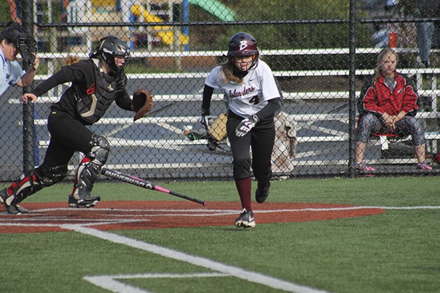 Mercer Island's Olivia Kane takes off after laying down a bunt against Sammamish Wednesday