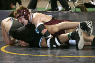 Islander senior Graham Horgdal competes in the 189-pound weight class during the Mat Classic state tournament.