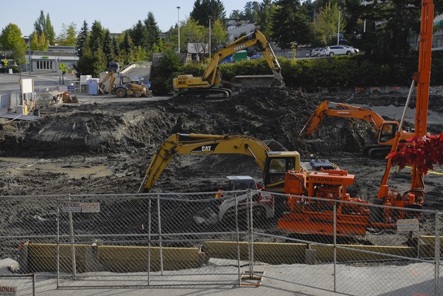 Heavy equipment works on the Aviara project in the 2400 block of 76th Avenue S.E. on Mercer Island last week. The old Safeway site will become a multi-use