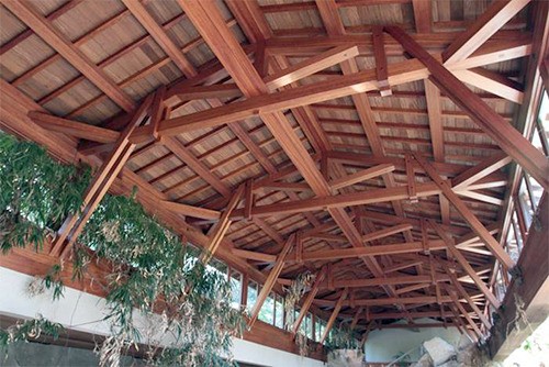 The trusses from the roof of the Coval pool house will be dismantled and stored in Woodinville until they can be installed in the lobby of the Mercer Island Center for the Arts.