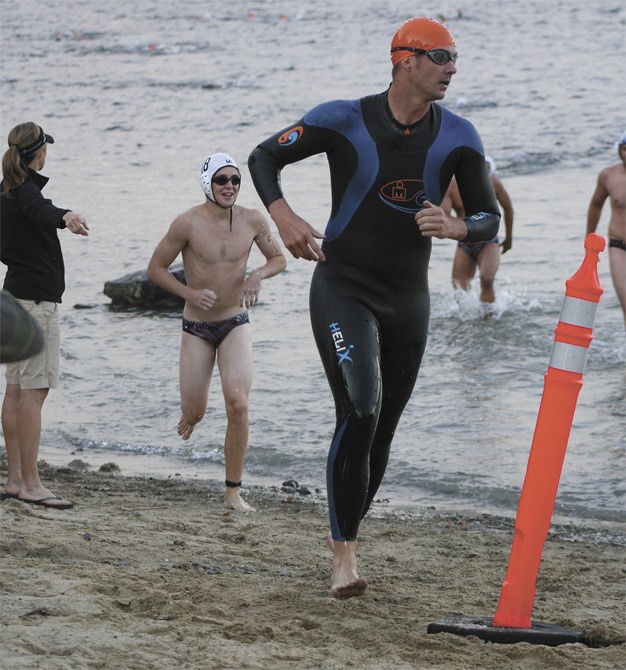 Participants in the 2010 Islander Aquathon head around the cone to start the second leg of the swimming portion of the race at Luther Burbank Park.