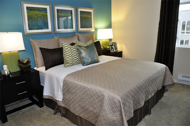 The master bedroom in the Aviara model unit features a wall that residents can have painted with a feature color.