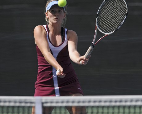 Islander doubles player Julia Zook returns a serve during last week’s SeaKing District tournament at Lower Woodland Park. Zook and her partner Kelly Crandall will play at state this week.