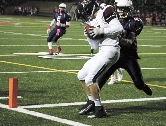 Mercer Island wide reciever Jack Counihan catches the two point conversion pass in the corner of the endzone during the first quarter of the Islanders loss to Juanita on Friday
