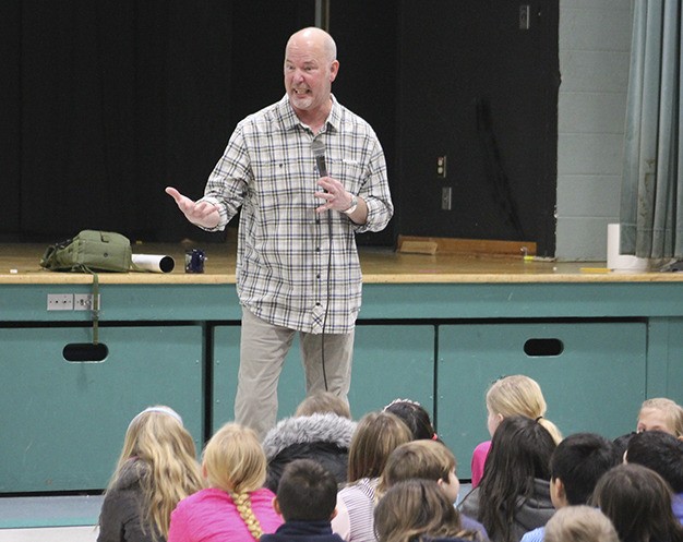 Author Paul Owen Lewis discusses how he writes books with students at Island Park Elementary Tuesday