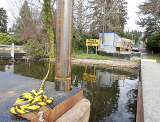 Construction portables and a floating barge have been set up at Proctor Landing in preparation for the lakeline sewer project