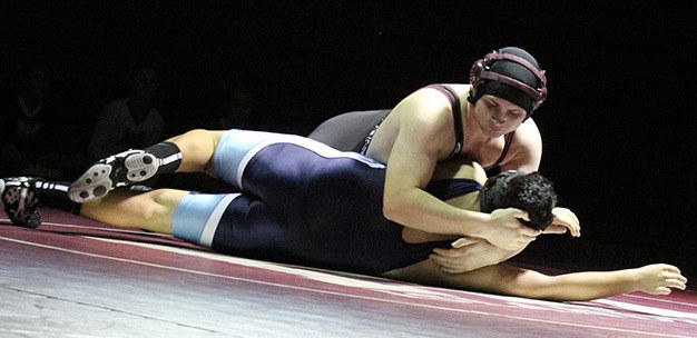 Mercer Island 285-pounder Dylan Majewski pins Interlake grappler Alexis Anaya in the first match of the Islanders’ dual meet against the Interlake Saints. Interlake eventually defeated Mercer Island 36-32. The Saints clinched the Class 3A KingCo regular season championship with the win.