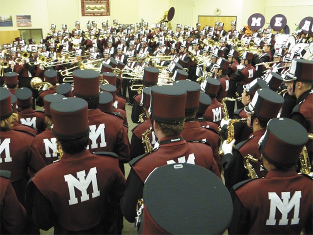 Members of the Mercer Island High School marching band pack the rehearsal room at MIHS before All Island Band night last November. The band program is getting more space.