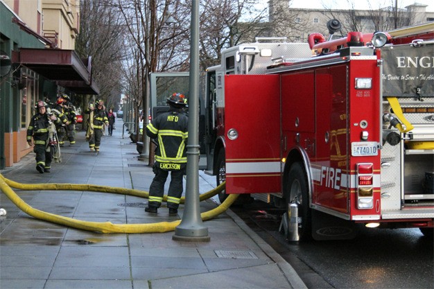 Firefighters respond to a small fire in a Newell Court apartment unit on Friday morning