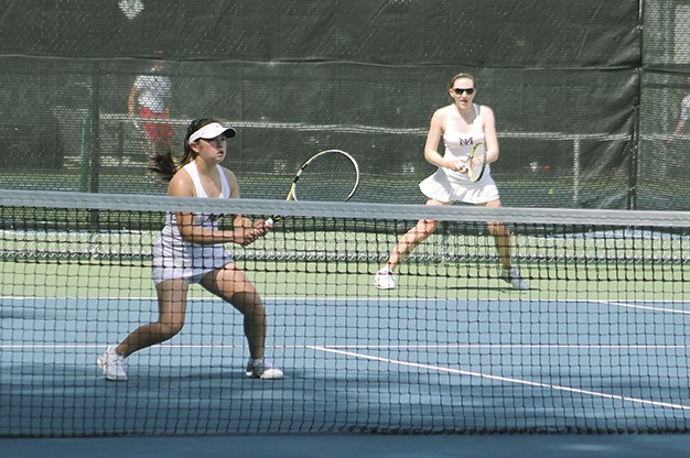 Sammy Sweet (left) and Caroline Hamilton compete in the 3A Sea-King girls tennis doubles final Wednesday
