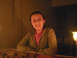 Kela Harrington plays Risk during Earth Hour on March 28.