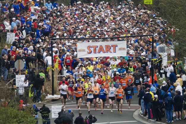 Runners start the annual Mercer Island Rotary Half Marathon event on Mercer Island on Sunday