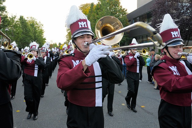 The Mercer Island High School marching band leads the way during the annual homecoming parade on Mercer Island on Friday.