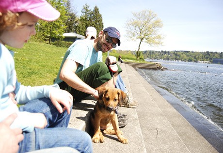 Islander Ian Wood enjoys a lunch break with his dog