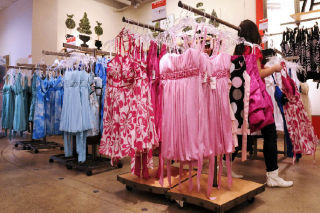 A girl browses prom dresses at Macy’s in the juniors department at Bellevue Square. The dress department has been swamped with teenage shoppers these past few weeks