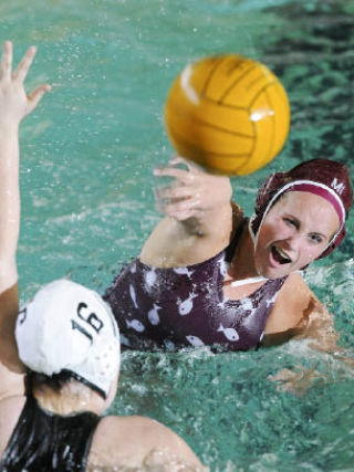 I-slander Emma Peterson shoots and scores against Roosevelt at Mary Wayte Pool on Wednesday. The Islanders won the game 14-5 in preparation for the state tournament