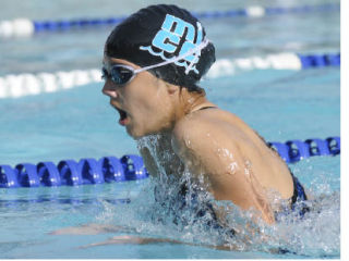 Allison Ratcey of the Mercer Island Country Club swims the second leg of the girls’ 11- and 12-year-old 200-meter medley relay on Thursday at the Shore Club.