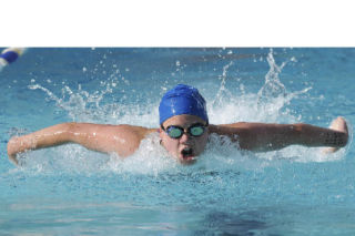 Mercerwood Shore Club swimmer Caitlin Aylward swims the third leg of the girls 15-and-over 200-medley relay.