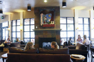 Artwork by Island artist Michal Goldberg hangs above the fireplace at the South-end Starbucks. The coffee shop held a grand re-opening earlier this month after weeks of remodeling done mostly at night. The shop has new furniture