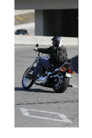 A motorcyclist enters the eastbound I-90 HOV lane along 80th Avenue S.E. on Mercer Island