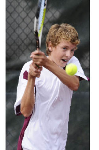 Islander freshman Jordan Smith returns a volley during a match at Bellevue