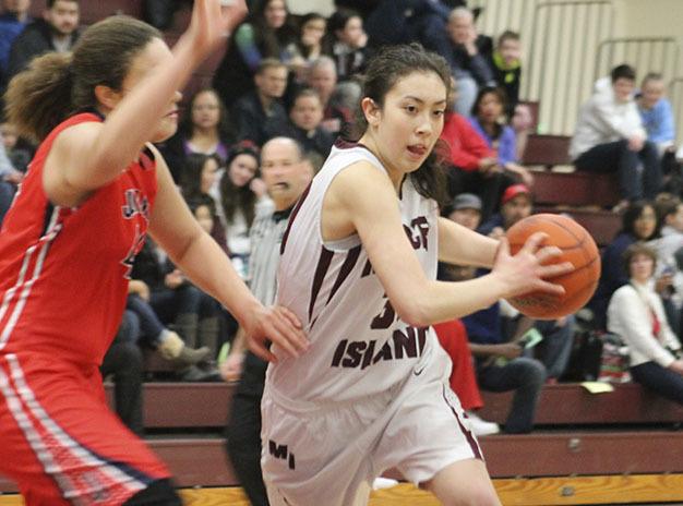 Mercer Island’s Renae Tessem drives past Juanita’s Jaissa Nunn Friday