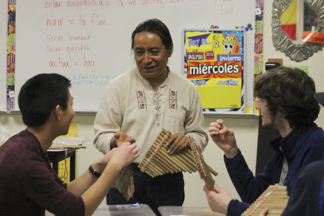 Quechuan musician Luis Gramal leads Spanish students in making antaras