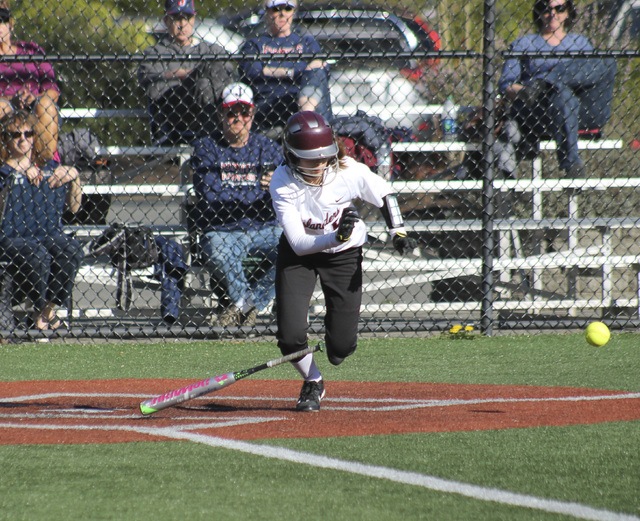 Joe Livarchik/staff photoMercer Island’s Camryn Steiner takes off after laying down a bunt against Juanita last Wednesday at South Mercer Playfields. The Rebels beat the Islanders 13-5.