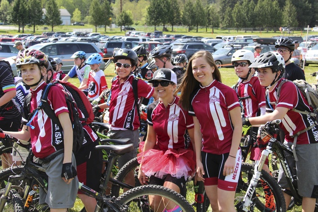 Coach Heather Libman (in tutu) poses with first-place finisher Taylor Libman as the Mercer Island Mountain Bike team lines up the 7th grade boys for their race at Pedaling the Peninsula on April 17 in Gig Harbor (photo courtesy of Bryan Toerne).