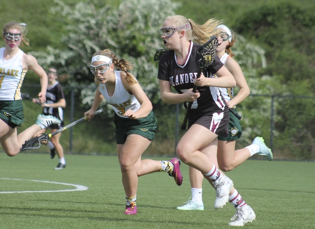 Mercer Island’s Elise Marks charges downfield against Overlake Friday in Redmond. Mercer Island won 19-3 (Joe Livarchik/staff photo).