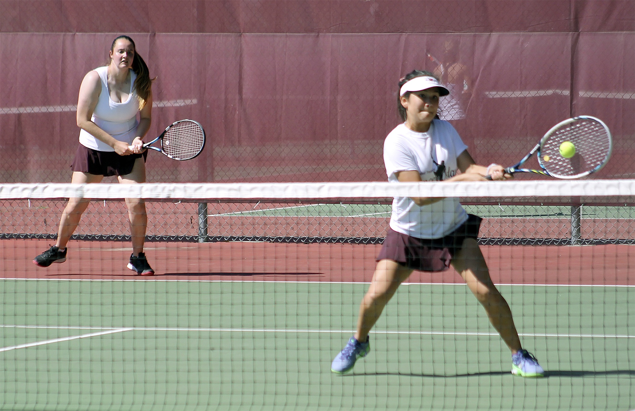 Mercer Island’s Fiona Brasfield (left) and Chloe Gage compete during the 3A KingCo girls tennis championships May 3 at Mercer Island High School. Brasfield and Gage placed third in the doubles bracket